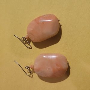 Salmon-colored stone earrings.
